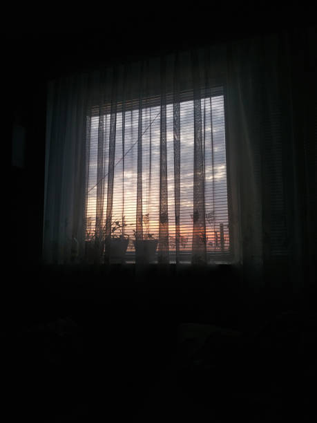 istock A tranquil evening sunset illuminating a cozy room through sheer curtains, showcasing a peaceful moment in nature 2175335107