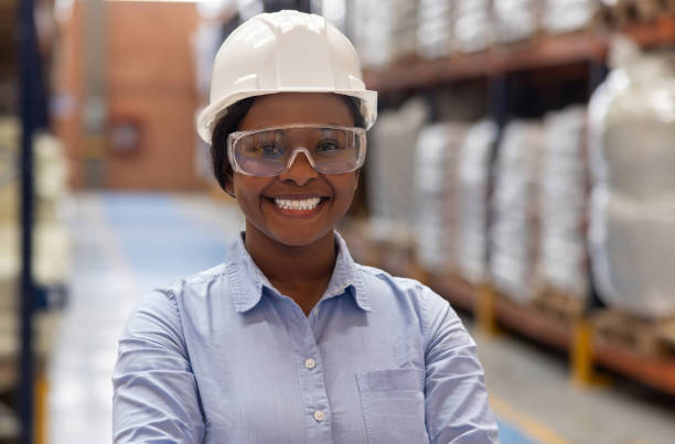 istock Business manager wearing a helmet at a distribution warehouse 2175336438