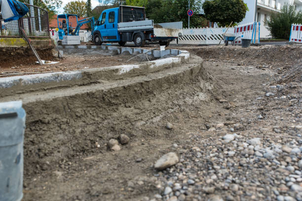 istock Road Construction Workers Operating Heavy Machinery and Equipment in an Urban Development Project 2175336864