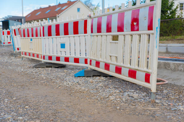 istock Road Construction Workers Operating Heavy Machinery and Equipment in an Urban Development Project 2175336867