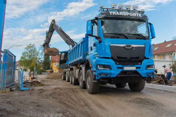 istock Road Construction Workers Operating Heavy Machinery and Equipment in an Urban Development Project 2175336991