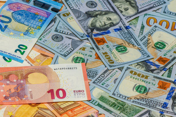 istock Fifty euro and one hundred dollar banknote money 2175337292