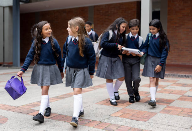 istock School children walking in the schoolyard while going to recess 2175339332