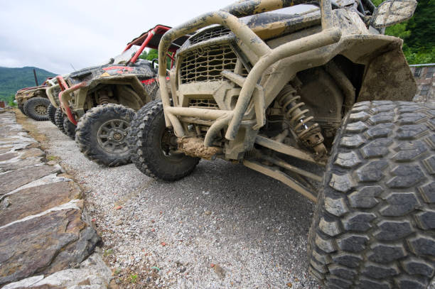 istock Looking down row of off road vehicles 2175344087