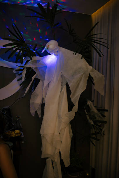 istock A ghostly figure made of white paper is lit up with blue lights 2175357083