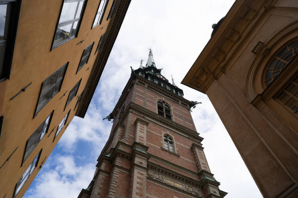 Colourful houses and a church tower in Gamla Stan, the old town of Stockholm, Sweden.