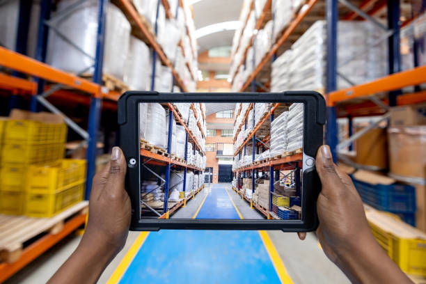 istock Warehouse worker taking pictures of a distribution warehouse 2175373324