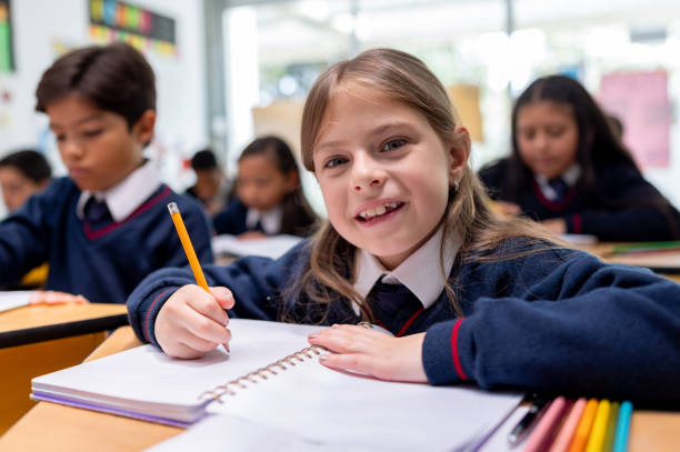 istock Happy girl studying in class at the school 2175373386