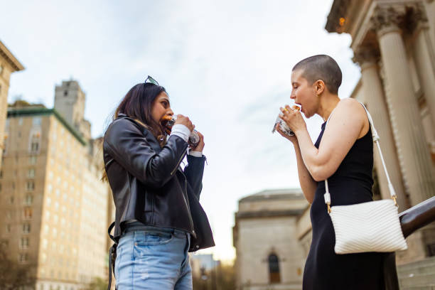 istock Two Friends Enjoying Coffee Outdoors 2175374301