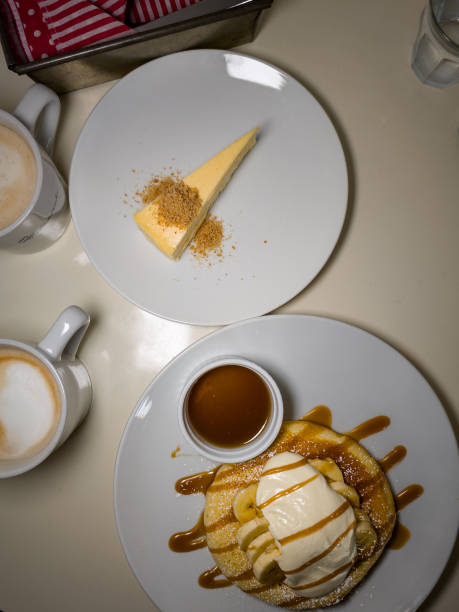 istock Fluffy and delicious caramel banana pancakes 2175374377