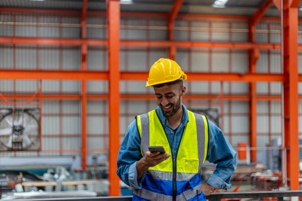istock Engineers working on a platform in a Metal Factory 2175377788