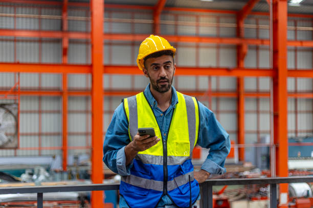 istock Engineers working on a platform in a Metal Factory 2175377791