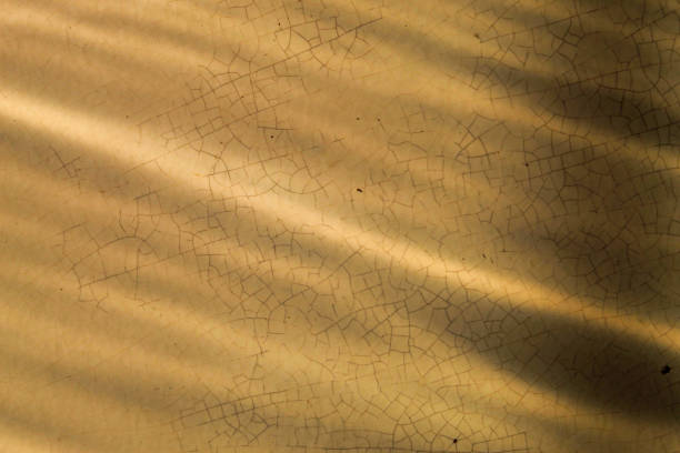 istock floor background with sunlight rays coming in. floor texture with natural sunlight shadows 2175384522