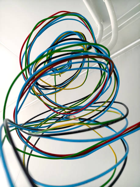 istock A collection of various wires is hanging down from the ceiling 2175387745