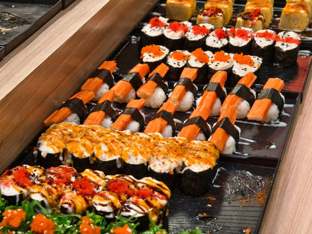 istock Delicious sushi rolls are beautifully arranged on plates 2175388662