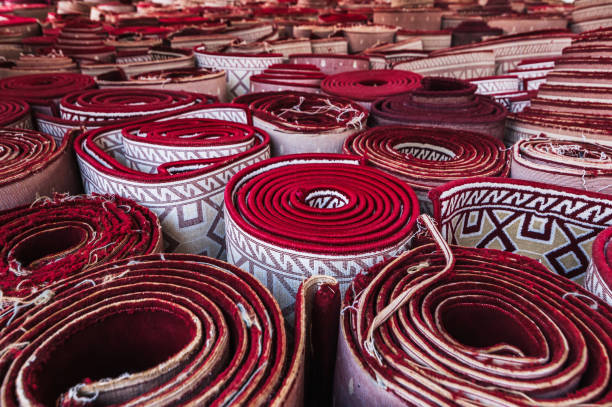 istock stack of rolled up tradition oriental red carpets for prayer Minor Mosque in Tashkent in Uzbekistan 2175392916