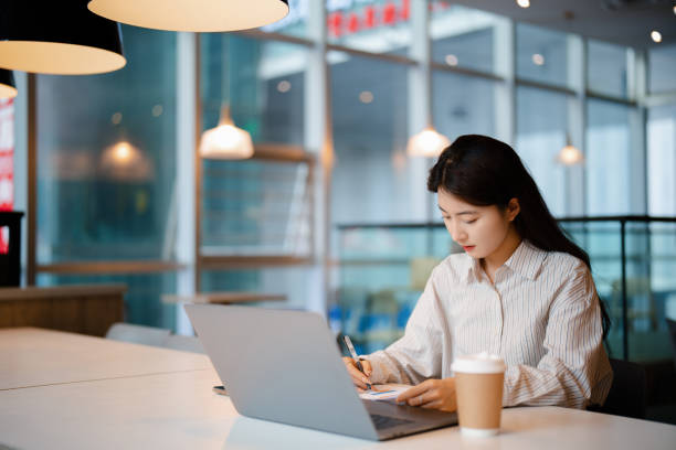 istock Young beautiful woman working in the office 2175395693