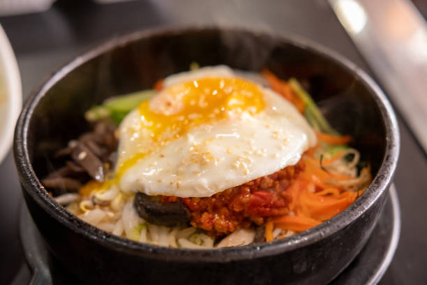 istock Bibimbap, a Korean rice dish. It is cooked rice mixed with namul, gochujang, egg and meat. 2175395764