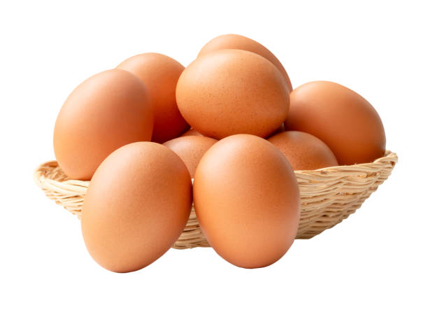 istock Group of fresh brown chicken eggs in stack in wicker basket is isolated on white background with clipping path. 2175396636