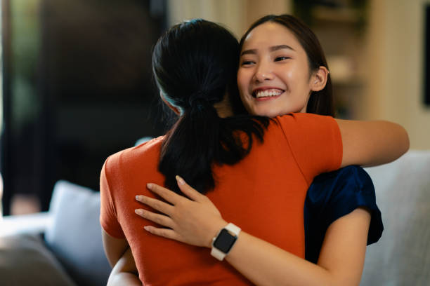istock Warm Embrace Between Two Friends at Home 2175398741