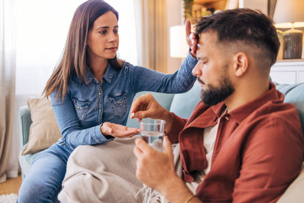 istock girlfriend taking care about his sick boyfriend 2175399161