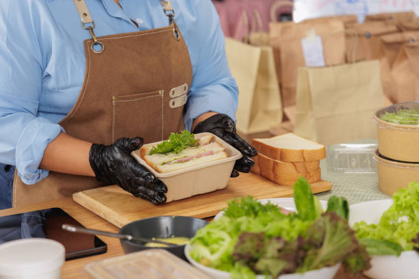 Preparing Fresh Sandwiches in Eco-Friendly Containers