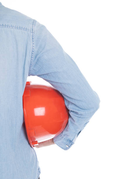 Businesswoman with construction red helmet. Isolated on white background, vertical view