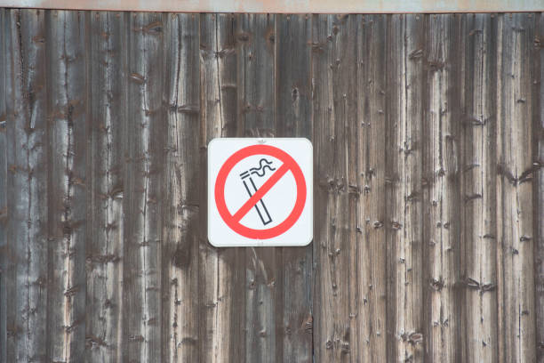 Close-Up Of No Smoking Sign On Table