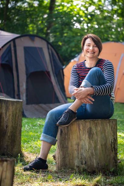 istock Happy smiling woman at camping site. 2175403261