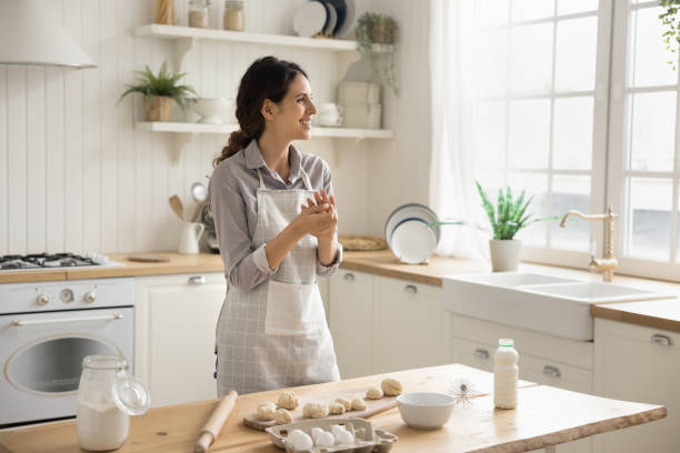 istock Hispanic woman in apron prepare pastries in the kitchen 2175403441