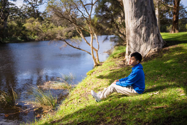 Lonely man looks at the lake