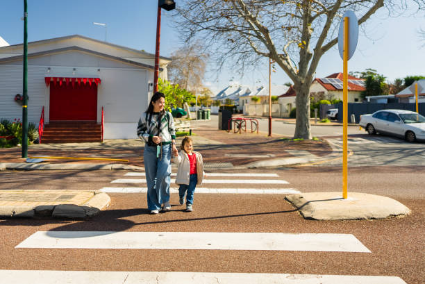istock Mother And Son Crossing Street 2175407769