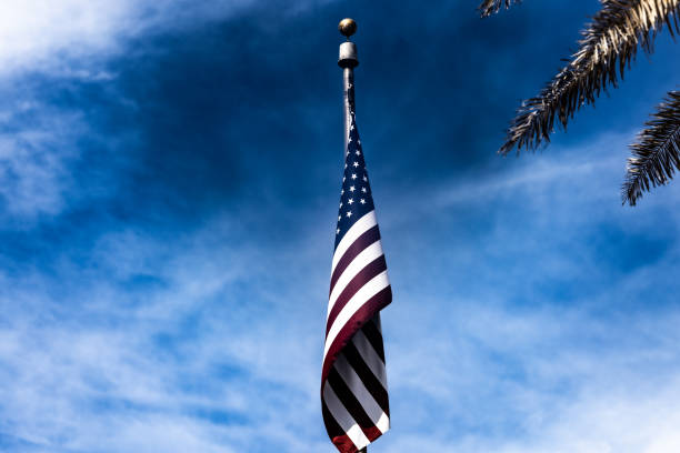 American Flag Flying Against a Vibrant Blue Sky