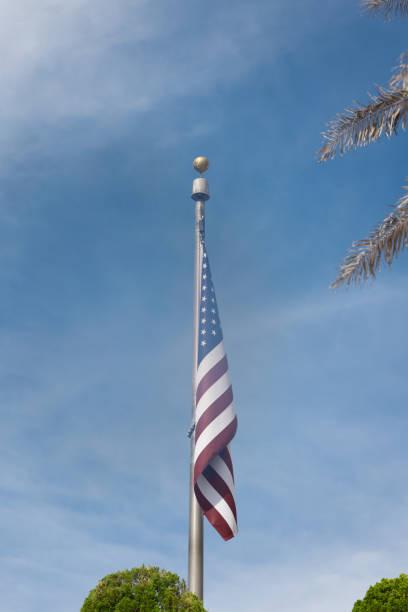 istock American Flag Waving Under a Clear Sky 2175408235