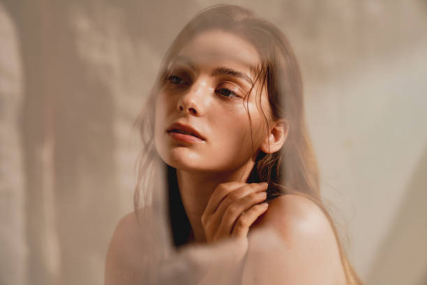 natural beauty portrait of a young western woman shot in warm tones - wanita cantik orang cantik foto potret stok, foto, & gambar bebas royalti