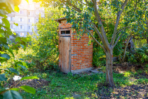 istock Brick toilet outdoors in a green garden 2175429029