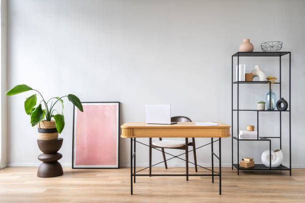 istock Workspace with a wooden desk, interior decor and indoor plants in home office 2175431576