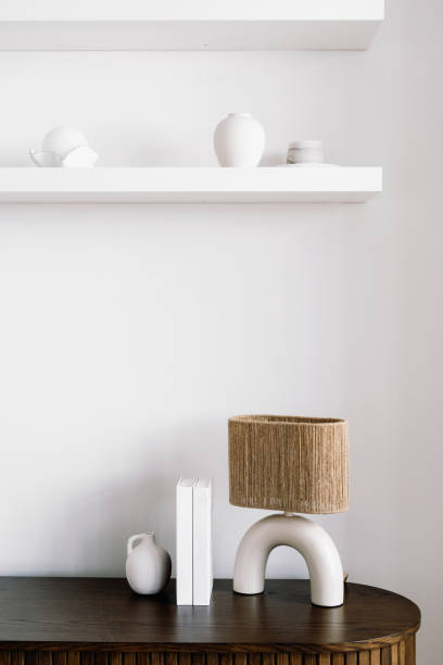 istock Contemporary living room decor with minimalist lamp and shelves in bright space 2175431632