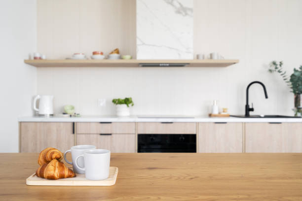 Kitchen counter with coffee cups and french croissants