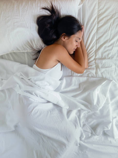 istock Woman sleeping on the bed at home 2175435866