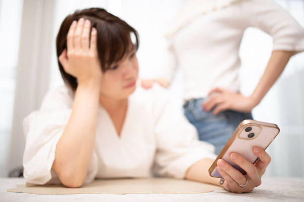 istock Two women looking at a smartphone 2175438124