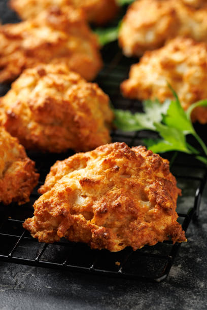 istock Homemade Cheddar Cheese Biscuits on a cooling rack 2175438200