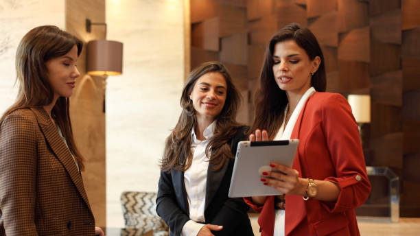 istock Three beautiful businesswomen meet to discuss important work matters 2175439715