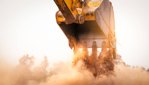 istock Backhoe working by digging soil at construction site bucket of crawler excavator breaking ground for new development project earth moving machine in action. Foundation work on construction project. 2175448228