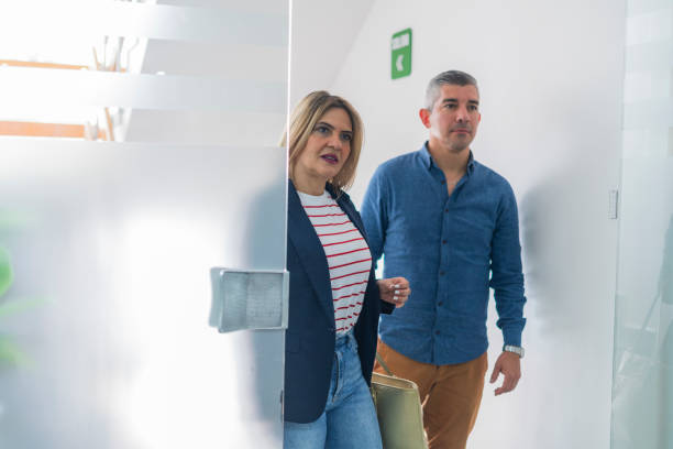 istock Advisor visits his client in the office and explains everything related to the business 2175451982