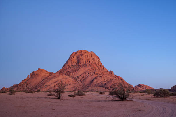 istock The Spitzkoppe is a group of bald granite peaks or inselbergs located between Usakos and Swakopmund in Namib desert I Namibia, sunset photo 2175452000