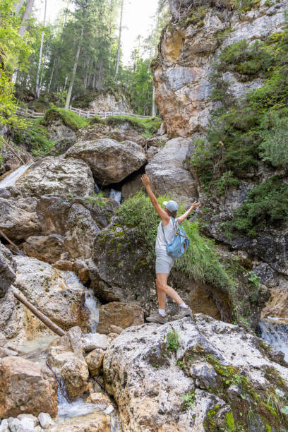 istock Adventurous Hiker On Rocky Terrain by Waterfall 2175456627