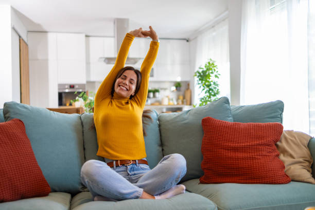 istock Relaxed Woman Enjoying A Peaceful Moment At Home On Sofa 2175459742