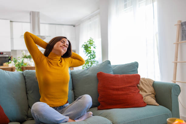 istock Relaxed Woman Enjoying A Peaceful Moment At Home On Sofa 2175459747