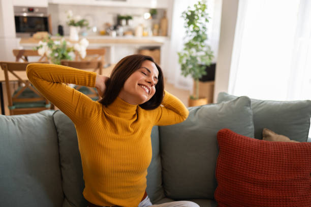 istock Relaxed Woman Enjoying A Peaceful Moment At Home On Sofa 2175459767